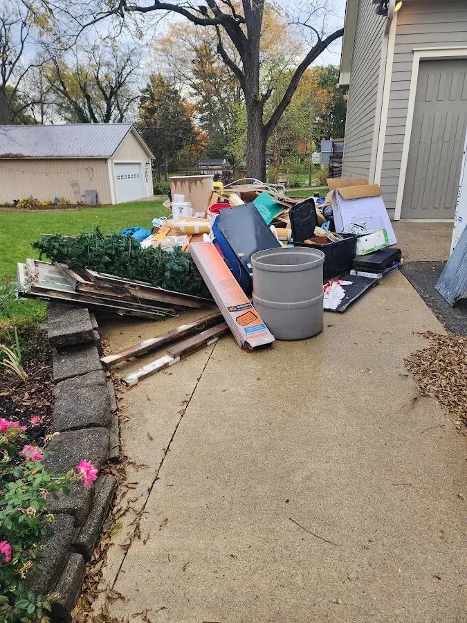 Dumpster being loaded with debris for Demolition Dumpster Rental in Mundelein